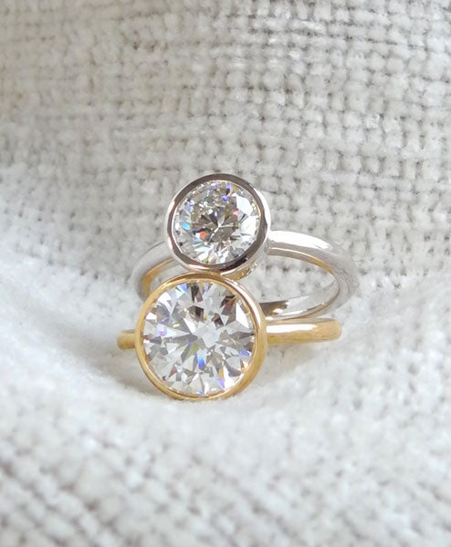 White Gold and Yellow Gold Bezel Set Engagement Rings